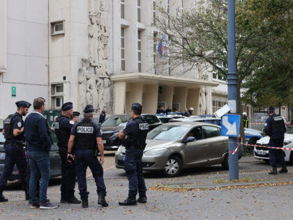 TOPSHOT - French police officers stand in front of the Gambetta high school in Arras, nort