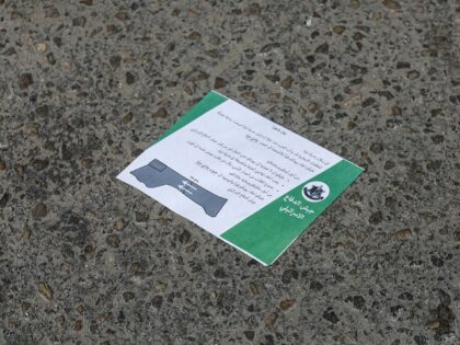 13 October 2023, Palestinian Territories, Gaza City: A leaflet lies on the ground dropped