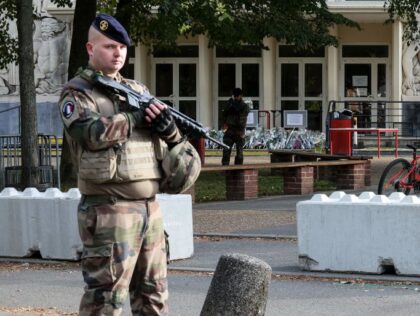French military servicemen of ongoing French military operation "Operation Sentinelle" stand guard in front of the Gambetta high school during its' evacuation after a bomb threat in Arras, northeastern France on October 16, 2023, three days after a teacher was killed and two other people were severely wounded on October …
