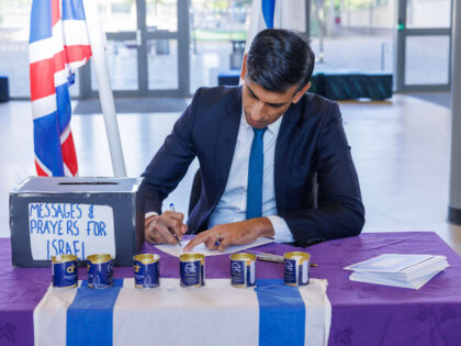 BARNET, ENGLAND - OCTOBER 16: Prime Minister Rishi Sunak writes a message of goodwill to t
