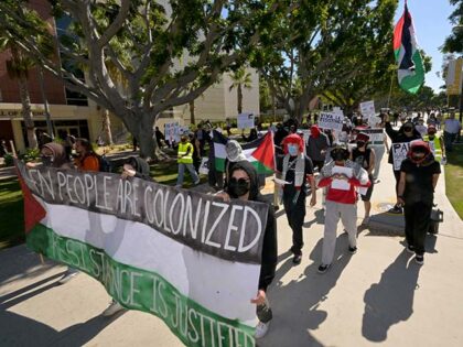 LA F.U.E.R.Z.A, a student-run advocacy group, marched through the campus of CSU Long Beach for a Day of Resistance protest for Palestine in Long Beach on Tuesday, October 10, 2023. The majority of participants wore face coverings and refused to speak with media but they did periodically stop and give …
