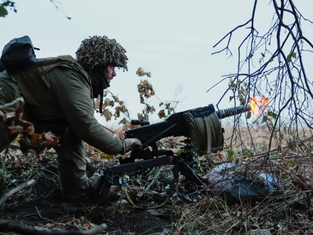 UNSPECIFIED, UKRAINE - OCTOBER 7: Ukrainian soldier fires with automatic grenade launcher