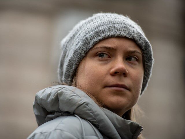 In this handout image provided by Greenpeace, Greta Thunberg speaks to the press as she jo