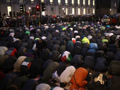 LONDON, ENGLAND - OCTOBER 18: Pro-Palestinian supporters pray as they attend a vigil for t