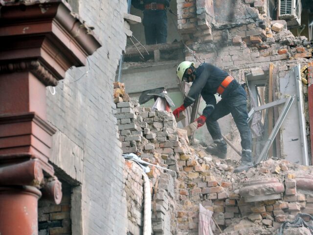 ZAPORIZHZHIA, UKRAINE - OCTOBER 19, 2023 - A rescuer removes rubble from an apartment buil