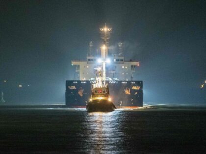 The cargo ship "Polesie" is guided into the harbour of Cuxhaven, northern German