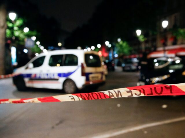 French police vehicles are seen behind a cordoned off area in front of the North station i