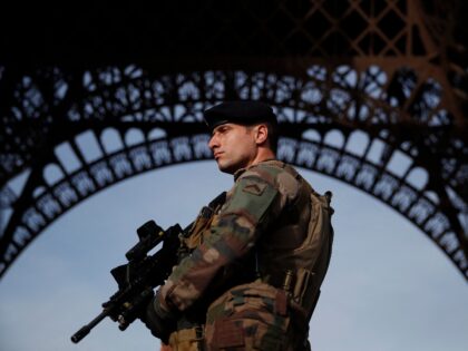 A French soldier, part of the "Operation Sentinelle", patrols in front of the Eiffel Tower on November 1, 2017 in Paris, as France officially ends the state of emergency. French President Emmanuel Macron on October 30 formally signed a sweeping counterterrorism law that replaces a 2-year-old state of emergency, following …