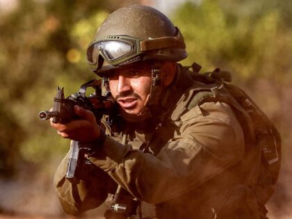 An Israeli army soldier advances during a drill at a position in the upper Galilee region