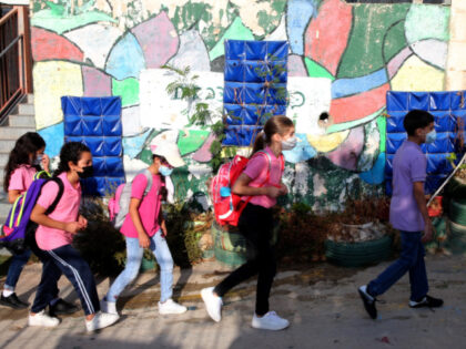 Children enter an elementary school on the first day of the new school year in Jerusalem o