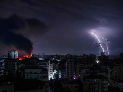 A plume of smoke rises in the sky of Gaza City during an Israeli airstrike on October 9, 2
