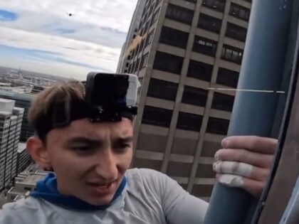 Pro-Life Spiderman climbs in Chicago