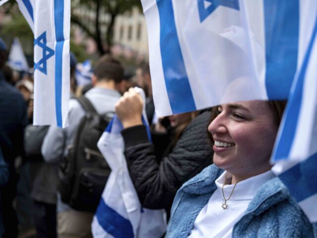 Smiling pro-Israel protester (Craig Ruttle / Associated Press)