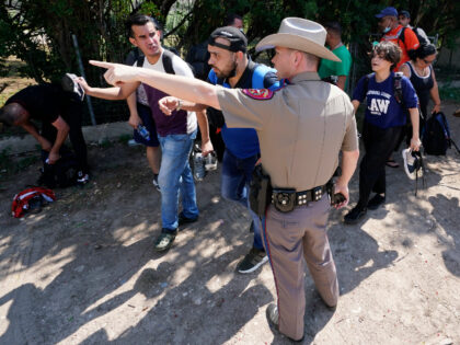 A Texas DPS Trooper Directs Migrants to CBP Border Crossing. (AP File Photo: Eric Gay)