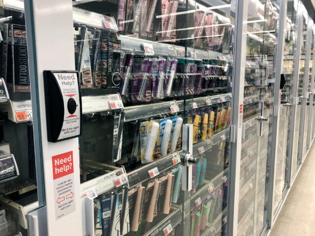 Anti-theft locked beauty products with customer service button at Walgreens pharmacy, Quee