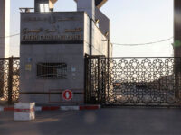 A picture taken on October 10, 2023, shows the closed gates of the Rafah border crossing with Egypt. Gaza's border crossing with Egypt, its only one that bypasses Israel, was hit by an Israeli air strike on October 10, 2023 for the second time in 24 hours, witnesses and a rights group said. Witnesses said the strike hit the no-man's land between the Egyptian and Palestinian gates, damaging the hall on the Palestinian side. (Photo by SAID KHATIB / AFP) (Photo by SAID KHATIB/AFP via Getty Images)
