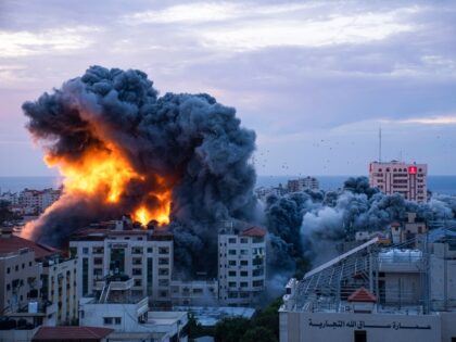 Fire and smoke rises following an Israeli airstrike, in Gaza City, Saturday, Oct. 7, 2023.