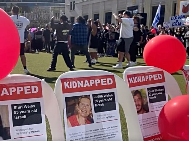 Participants in a New Zealand rally demanding the release of Israeli hostages in Gaza perf