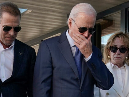President Joe Biden stands with his son Hunter Biden, left, and sister Valerie Biden Owens