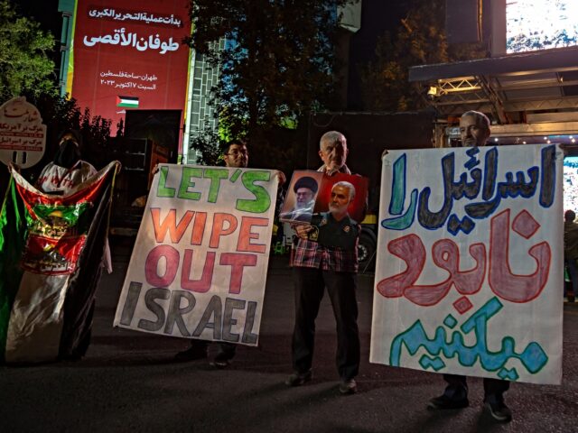 10/07/2023 Tehran, Iran. Iranian pro-government supporters hold banners showing support fo
