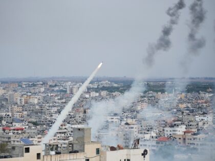 Rockets are launched by Palestinian militants from the Gaza Strip towards Israel, in Gaza, Saturday, Oct. 7, 2023. The militant Hamas rulers of the Gaza Strip carried out an unprecedented, multi-front attack on Israel at daybreak Saturday, firing thousands of rockets as dozens of Hamas fighters infiltrated the heavily fortified …