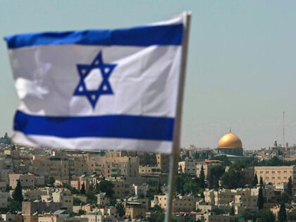 JERUSALEM - AUGUST 18: An Israeli flag flies from the Kidmat Zion Jewish settlement commun