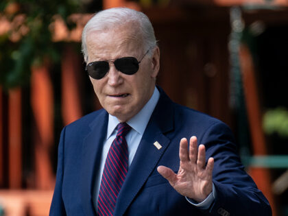 President Joe Biden waves to the press as he walks to Marine One on the South Lawn of the