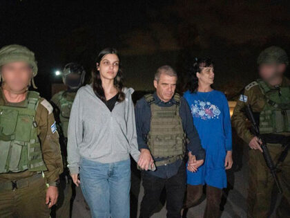 Judith Raanan, right, and her 17-year-old daughter Natalie are escorted by Israeli soldier