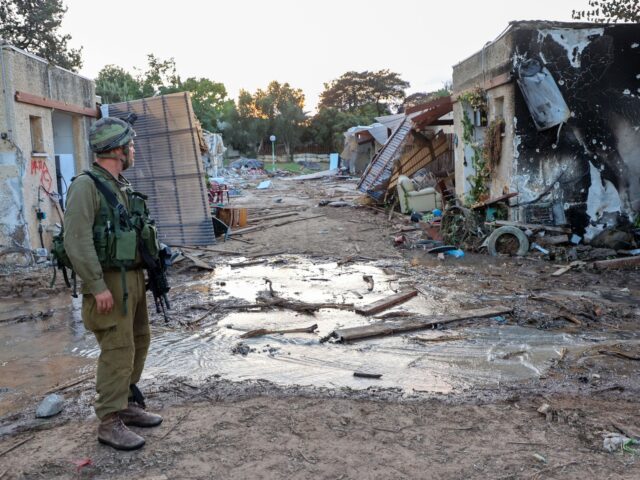 TOPSHOT - Israeli troops search the scene of a Palestinian militant attack in the Israeli