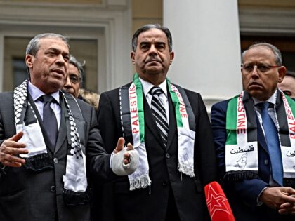 Palestinian Ambassador to Russia Abdel Hafiz Nofal (2nd L) makes a statement during the me
