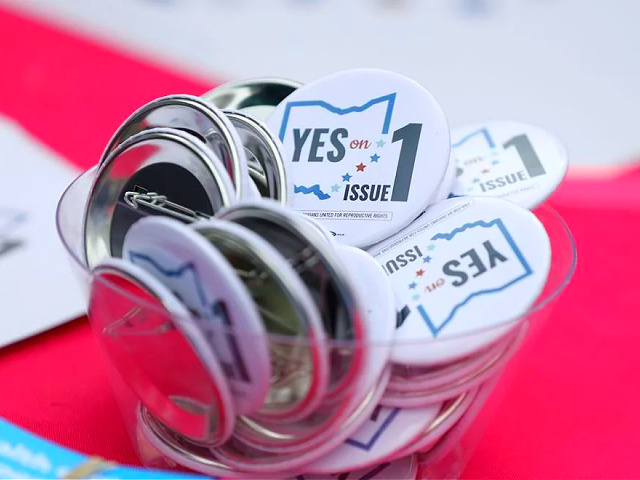 Buttons in support of Issue 1, the Right to Reproductive Freedom amendment, sit on display at a rally held by Ohioans United for Reproductive Rights at the Ohio Statehouse in Columbus, Ohio, Sunday, Oct. 8, 2023. (AP Photo/Joe Maiorana)