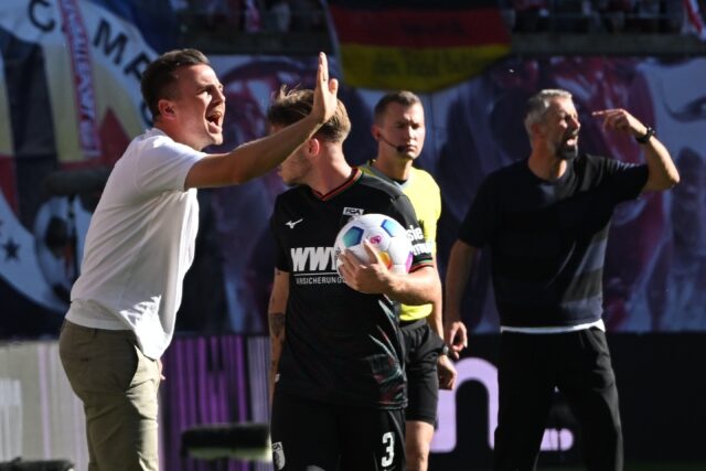 Augsburg's German head coach Enrico Maassen (L) spent just over a year at the Bavarian clu