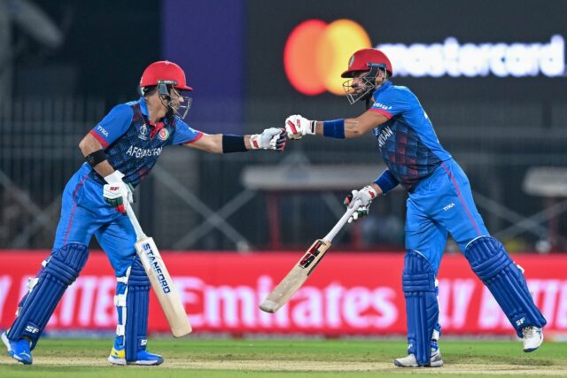 Open for business: Afghanistan's Ibrahim Zadran and Rahmanullah Gurbaz (left) bump their f