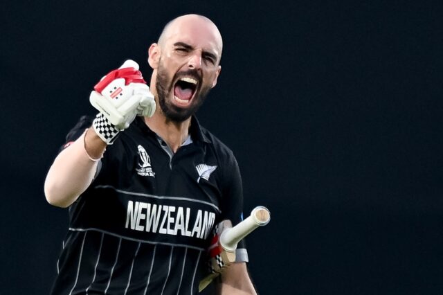 Century maker: New Zealand's Daryl Mitchell celebrates after scoring a hundred on Sunday