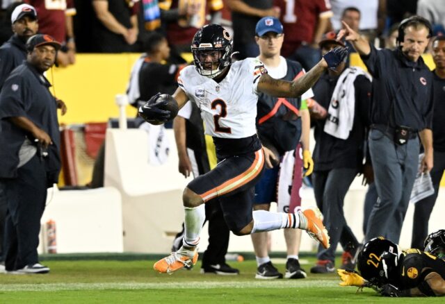 Chicago receiver DJ Moore runs with the ball in the first half of the Bears' 40-20 NFL vic
