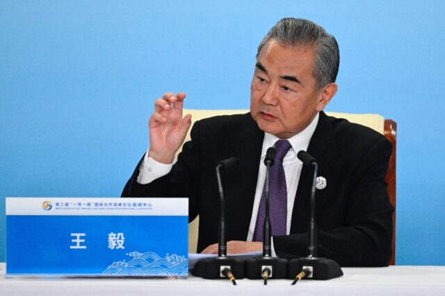 Chinese Foreign Minister Wang Yi answers a question at a press briefing during the Third B