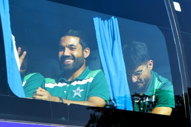 'Dedicated to Gaza': Pakistan's Mohammad Rizwan (left) gestures as the team bus leaves the