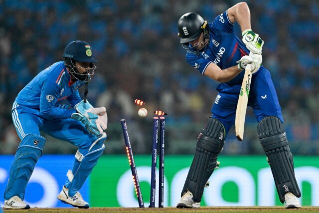 Down and almost out: England captain Jos Buttler is clean bowled by India's Kuldeep Yadav