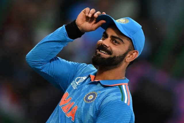 Fan favourite: India's Virat Kohli gestures to spectators during the win over Afghanistan