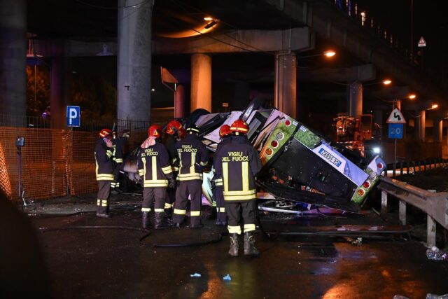 Firefighters said the bus caught fire after careering off a bridge straddling a railway li