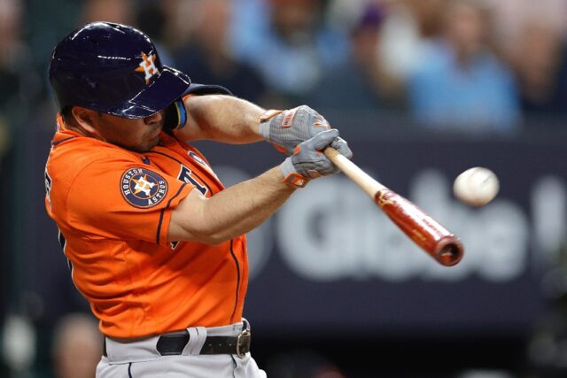 Houston's Jose Altuve hits a solo home run off Max Scherzer of the Texas Rangers during th