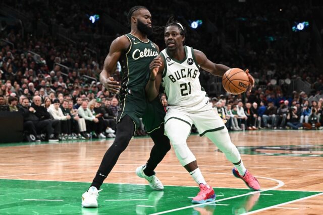 Jrue Holiday, at right driving against Boston's Jaylen Brown, will be playing for Boston t