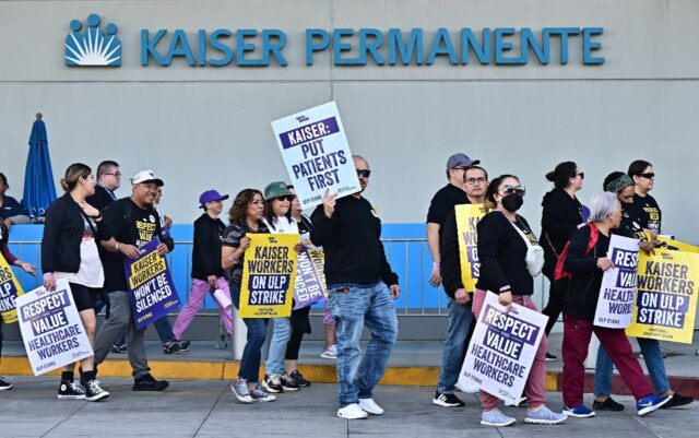 Kaiser Permanente and unions representing thousands of workers have reached a tentative de