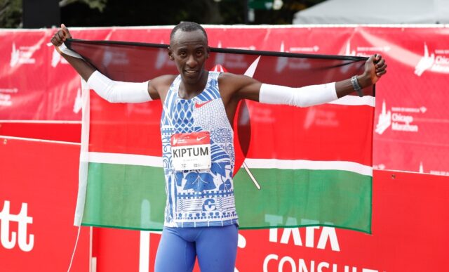 Kenya's Kelvin Kiptum celebrates winning the Chicago Marathon in a world record of two hou