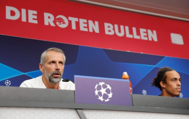 Leipzig head coach Marco Rose (L) and forward Yussuf Poulsen at a press conference ahead o