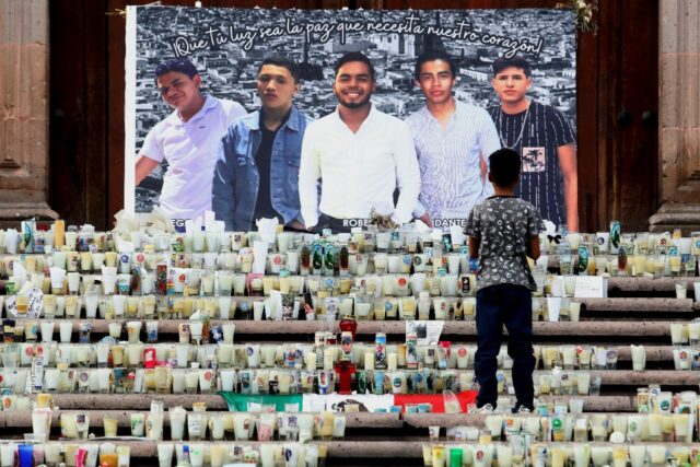 A memorial altar for five missing and apparently murdered young men has been set up outsid