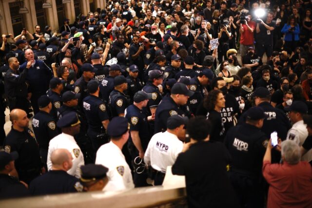 NYPD officers move in on a sit-in organised by Jewish groups calling for a ceasefire in th