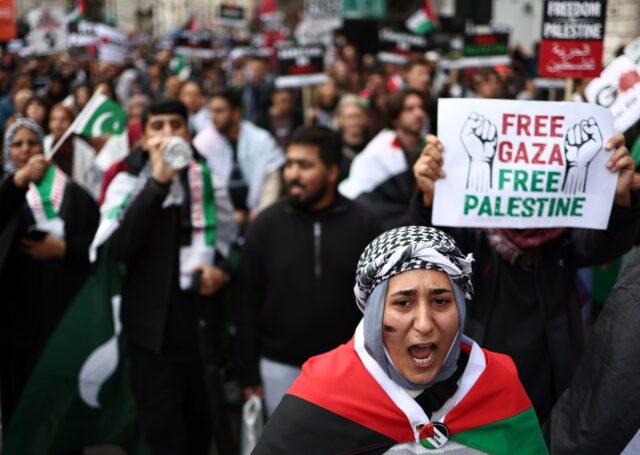 People take part in a 'March For Palestine' to 'demand an end to the war on Gaza'