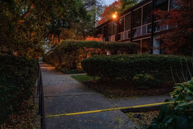 Police tape blocks the area where a Detroit synagogue leader was found dead on October 21,