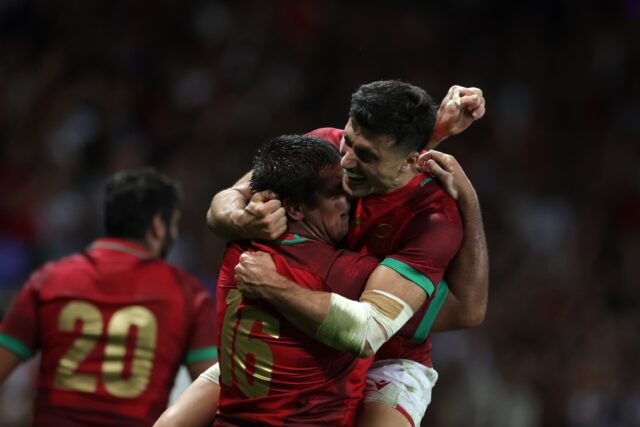Portugal wing Raffaele Storti (R) and hooker David Costa celebrate after victory over Fiji